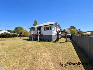 WALLANGARRA - ROOM TO MOVE, ROOM TO GROW – RENOVATED HIGH-SET HOME WITH VIEWS - 1/2 ACRE